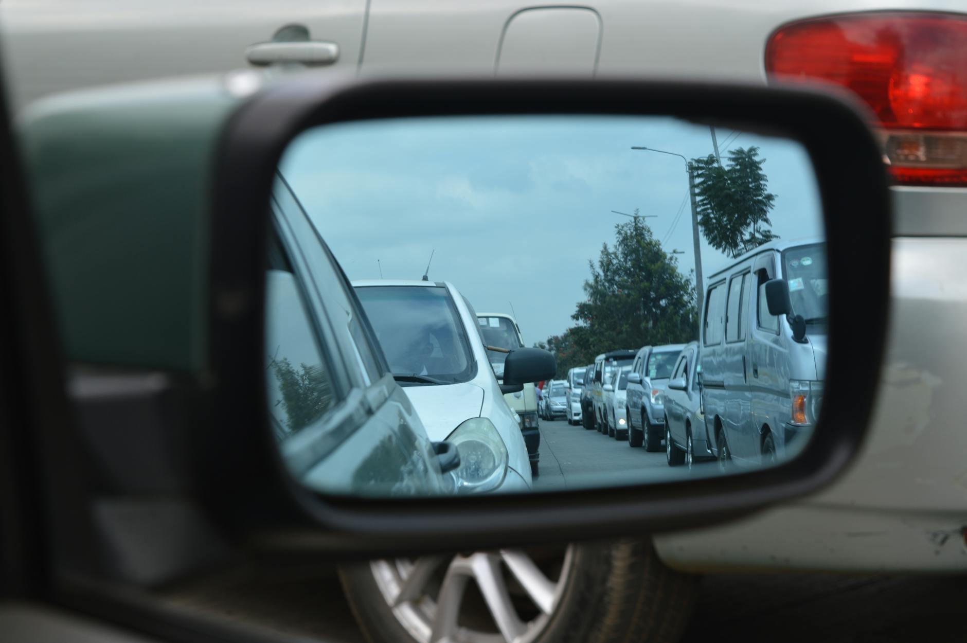 car side mirror showing heavy traffic